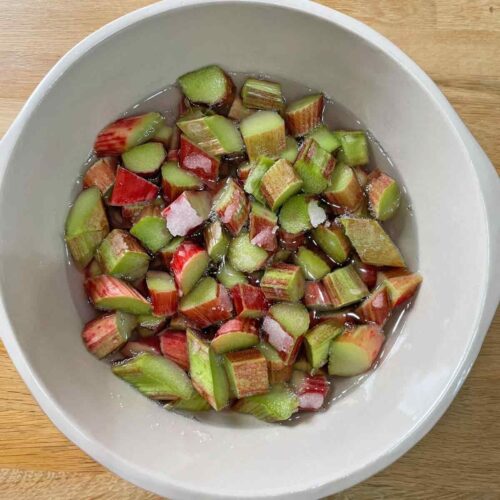 Rhubarb and sugar in bowl