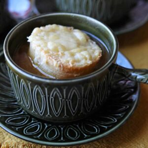 Slow Cooker French Onion Soup in bowl with cheee crouton