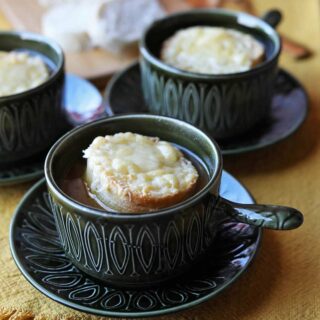 Bowls of French onion soup with croutons
