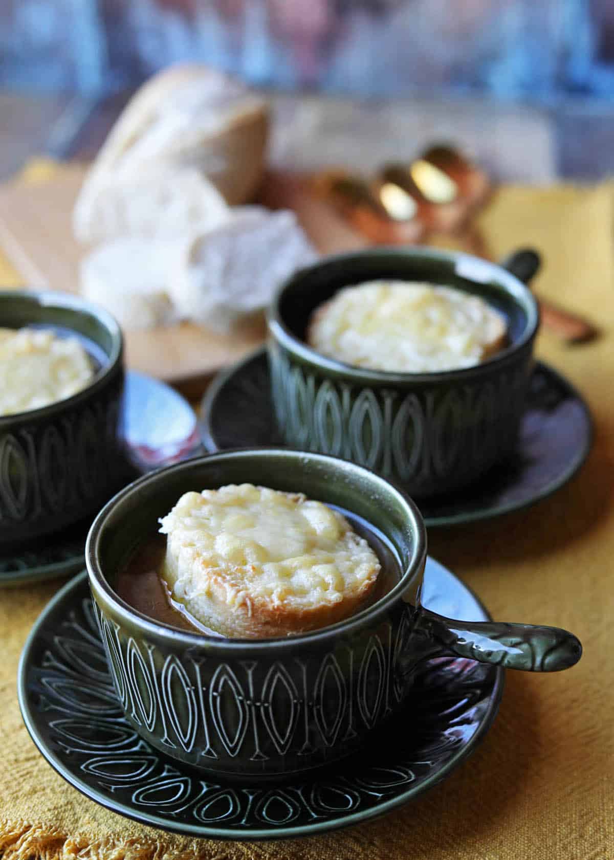 Slow Cooker French Onion soup in bowls with croutons