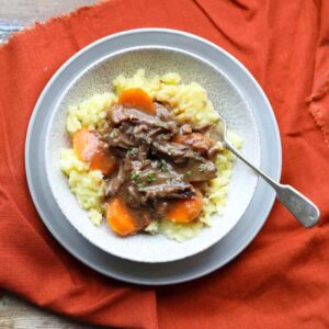Slow Cooker Beef Short Ribs on mashed potatoes and carrots