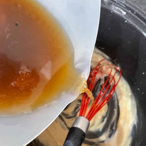 Add beef stock to sauce