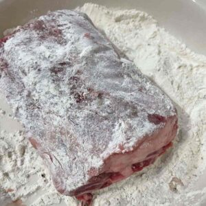 Beef short ribs coated in flour