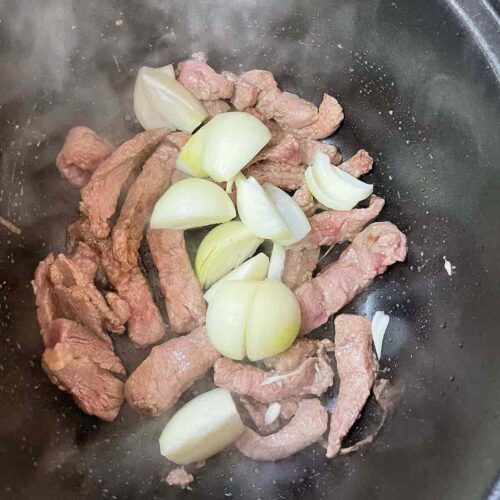 Slow Cooker Massaman Curry add the onion to the beef