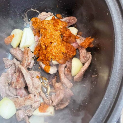 Add massaman curry paste to the beef