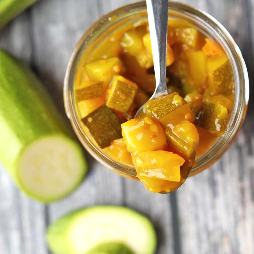 Courgette Relish in jar with spoon