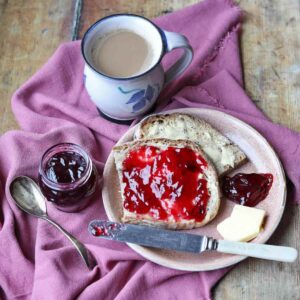 Sloe Gin Jelly on bread with coffee cup and jam jar
