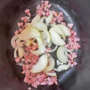 Add onions to bacon