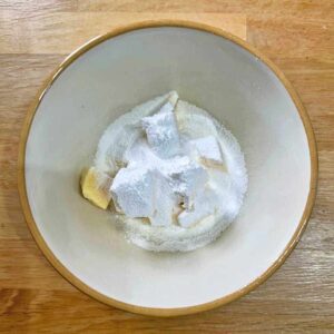 Brandy Butter bowl with butter and icing sugar in it