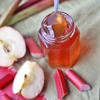 rhubarb and apple jelly with apples and rhubarb stalks