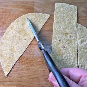 Cut tortilla stips into triangles