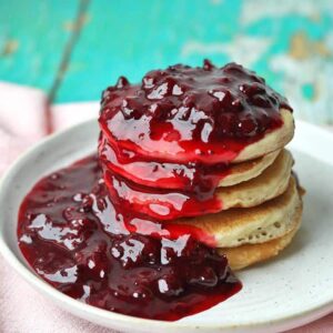 blackrurrant compote on pancake stack.