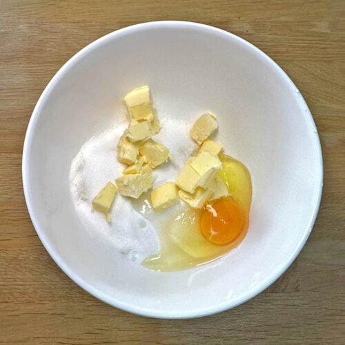 flour butter and egg in a bolw for frangipane.