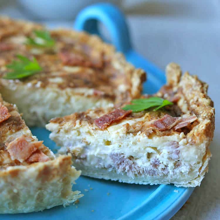 Slice of air fryer quiche lorraine.