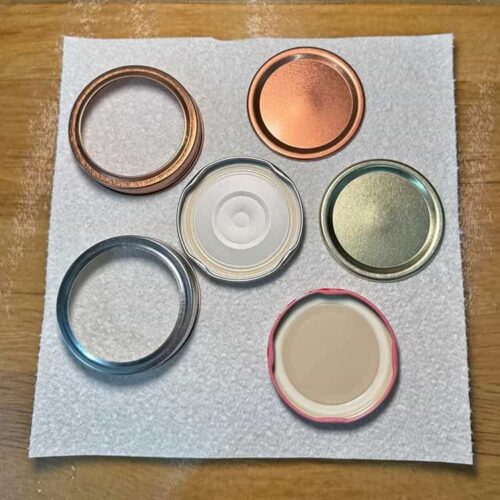 dry lids on kitchen paper.