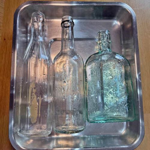 sterilise bottles lay flat on baking tray.