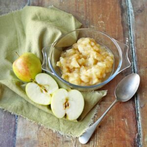 apple compote (stewed apples) with spoon.