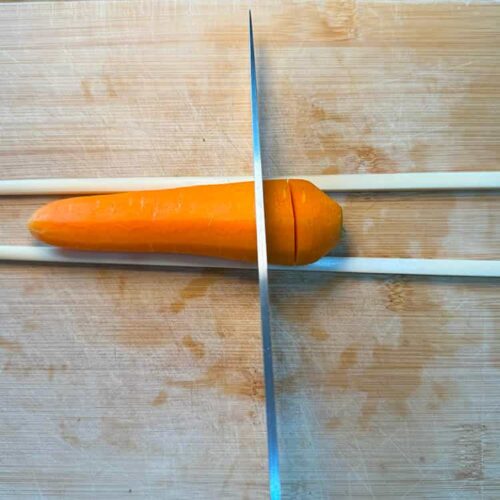 carrot and chopsticks to make partial cuts in the carrots.