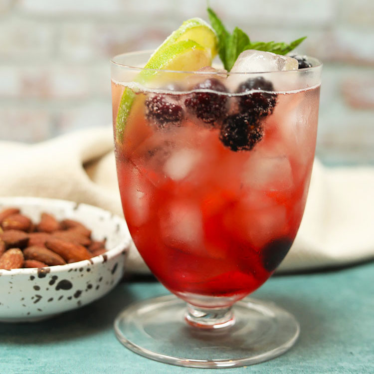 blackberry gin with ice and lemon.